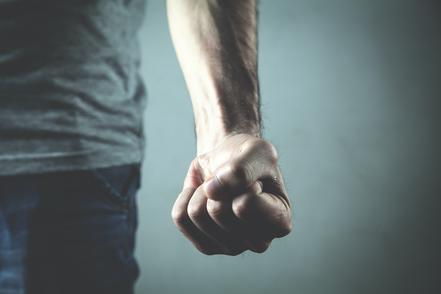 man with clenched fist in anger