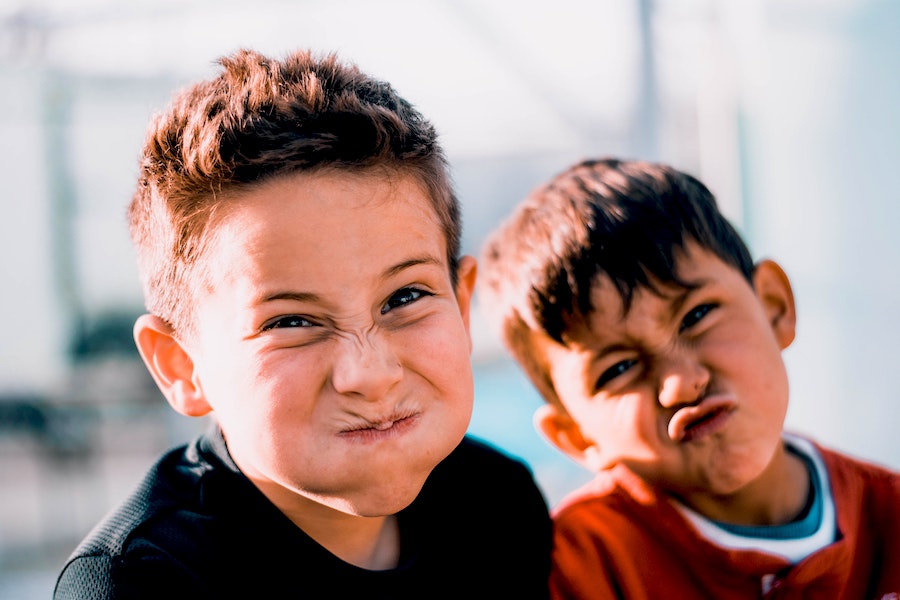 boys making silly faces and acting goofy